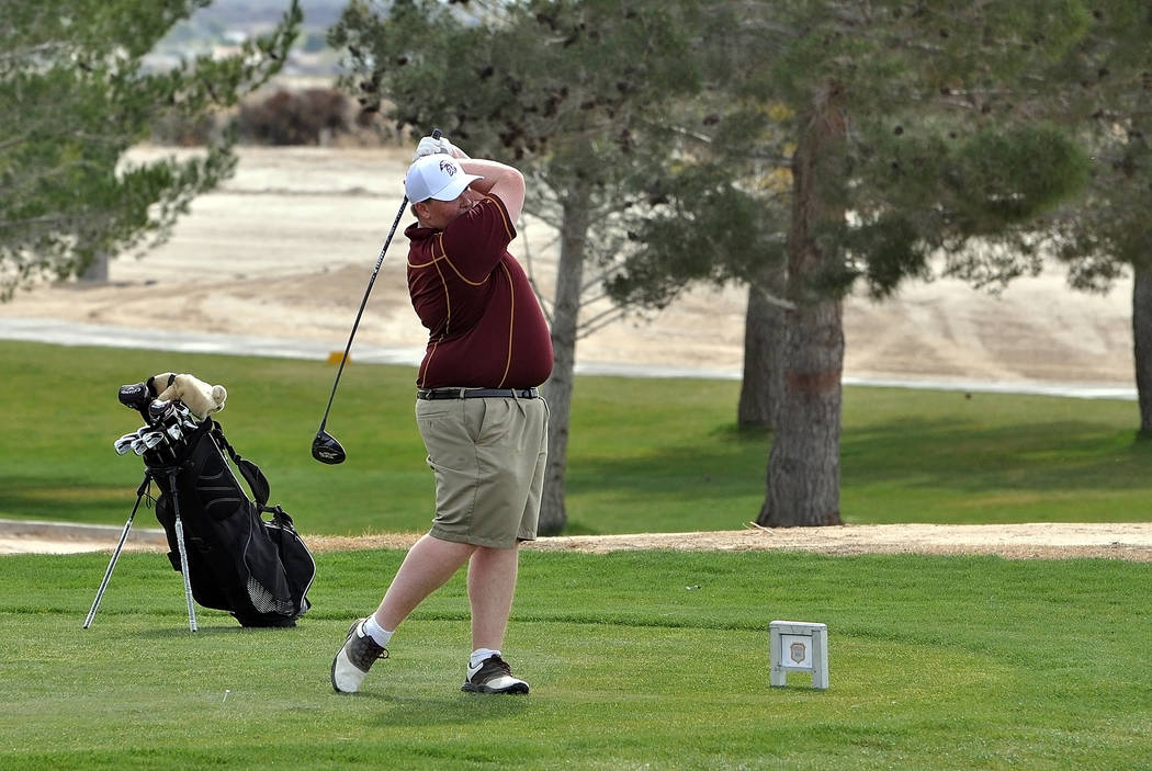 Trojans golfer Mike McDougall is seen teeing off on hole two at Mountain Falls during the Pahrump Valley Invitational on Friday. Horace Langford Jr. / Pahrump Valley Times