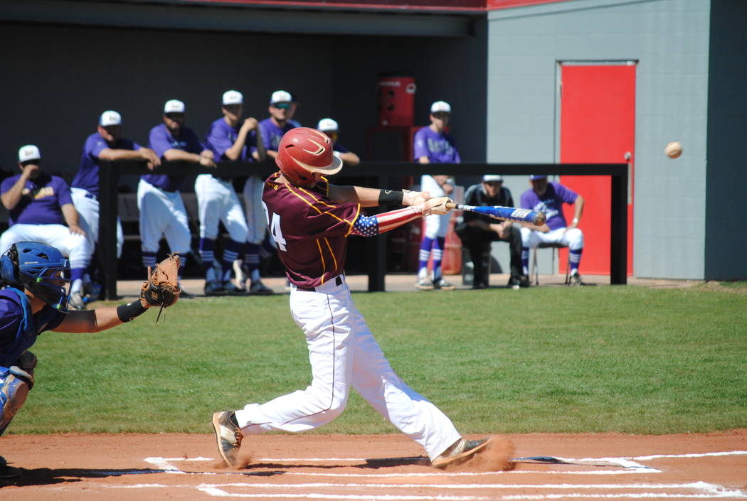 The Trojans’ Willie Lucas lets the ball rip in a baseball tournament in Arizona over the weekend. The Trojans went 1-4 but got over their first game jitters and will play this Thursday on the ro ...