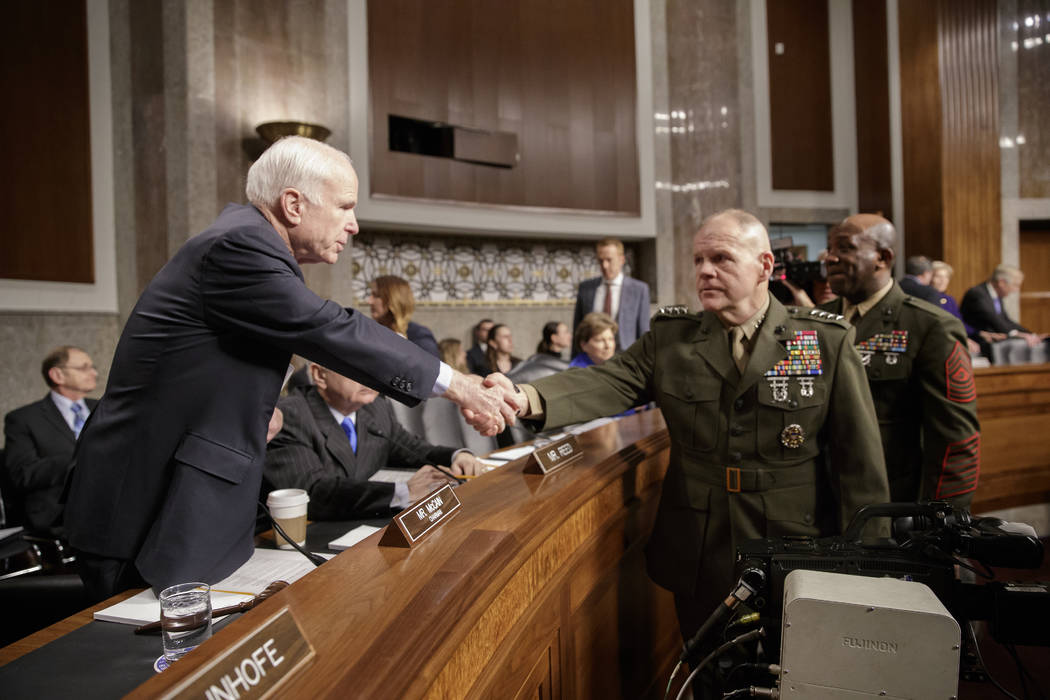 Senate Armed Services Committee Chairman Sen. John McCain, R-Ariz., left, welcomes Marine Corps Commandant Gen. Robert B. Neller, center, and Sgt. Major of the Marine Corps Ronald L. Green on Capi ...