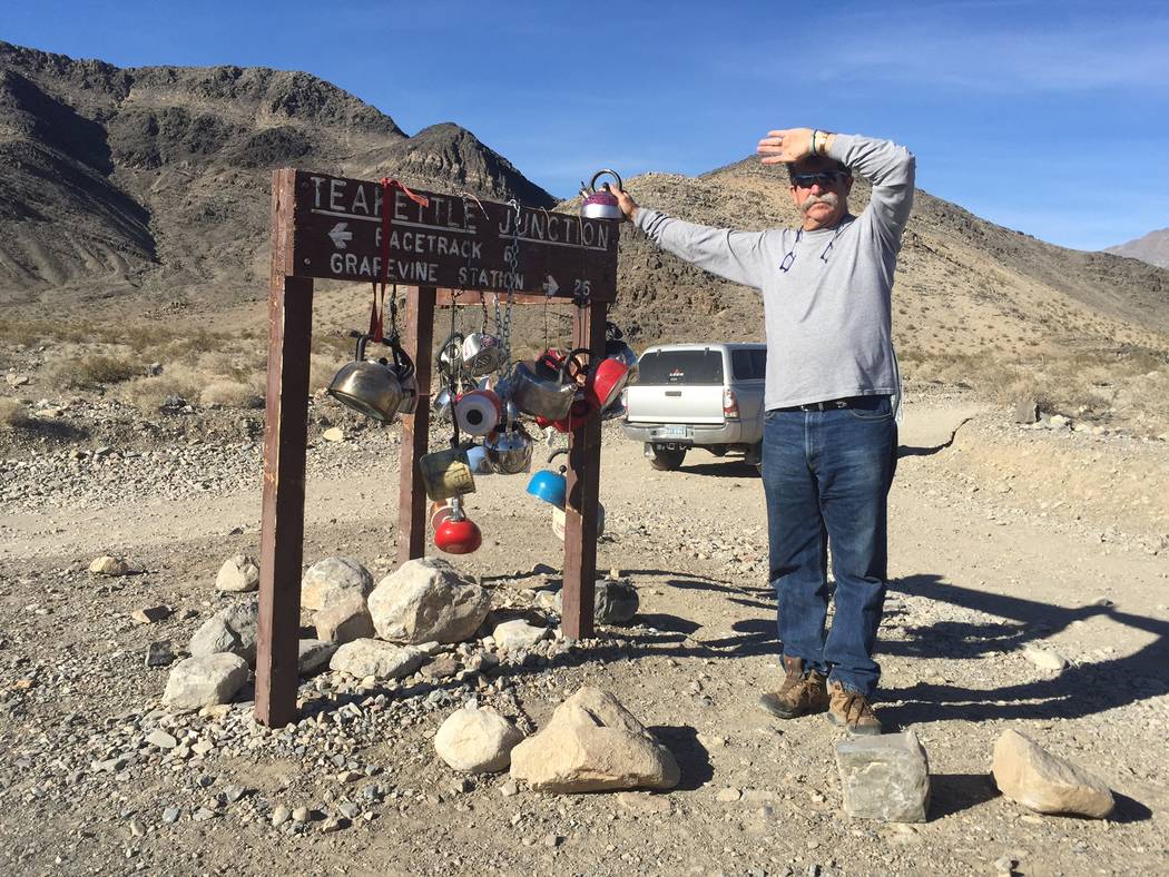 Dee Conton, one of the owners of Death Valley Desert Tours, poses next to a sign en route to the Death Valley National Park Racetrack. Death Valley Desert Tours, that was started by Dee and Barabr ...