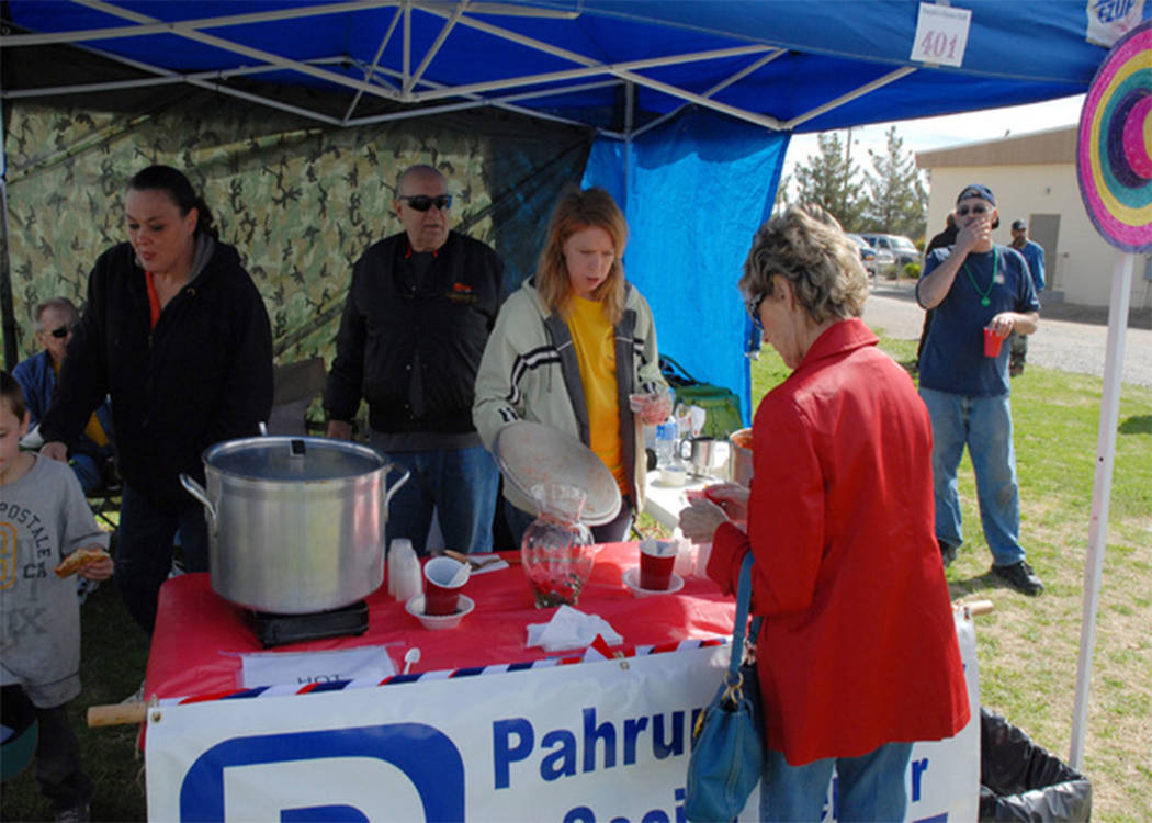 Officials from the Pahrump Senior Center serve up a cup of their award-winning chili during last year’s event. The senior center has taken home the Judges’ Chioce award four years in a row, ea ...