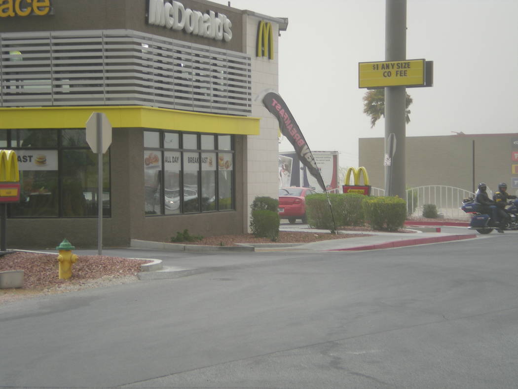 Vern Hee / Pahrump Valley Times
Gusty winds blowing flags around at the McDonalds on Highway 160.