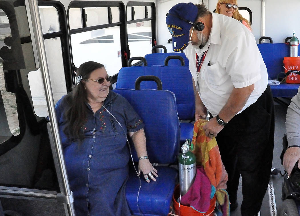 Horace Langford Jr. / Pahrump Valley Times
VETrans bus driver Anold Bluder secures Geogina Cross's oxygen bottle. NyE Communities Coalition began operating VETrans in June 2016, thanks to the Neva ...