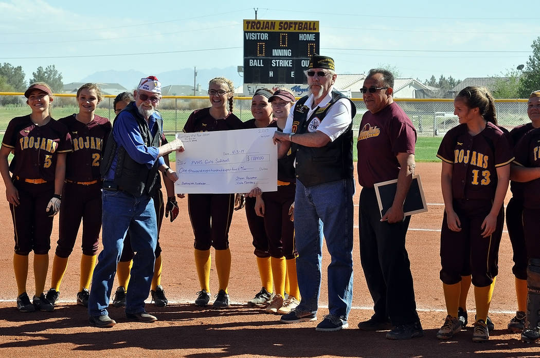 Horace Langford Jr. / Pahrump Valley Times  On Monday before the Trojans softball game with Desert Pines the Pahrump VFW post 10054 presented the Trojans softball team with a check for $1,884, whi ...