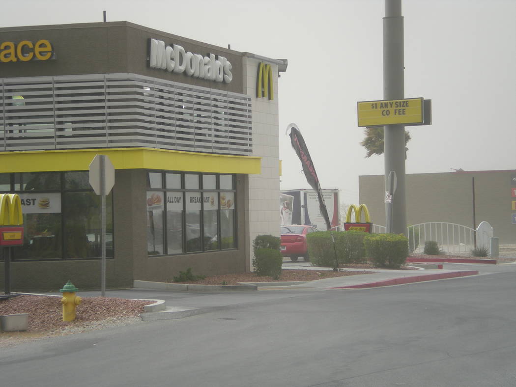 Vern Hee / Pahrump Valley Times
A flag at McDonald's on Highway 372 is thrashed about during the March 30 windstorm.