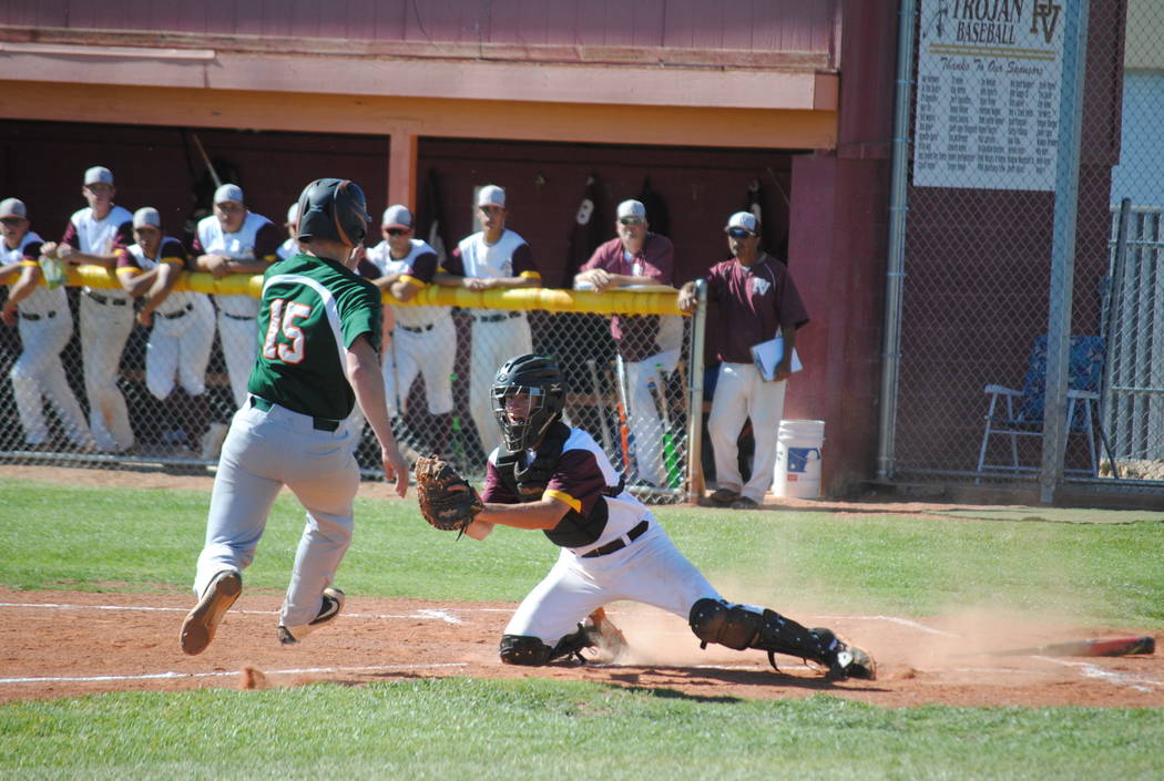 Charlotte Uyeno/Pahrump Valley Times
He's out at home. Willie Lucas makes a tag at home from a perfect throw from Parker Hart in left field.