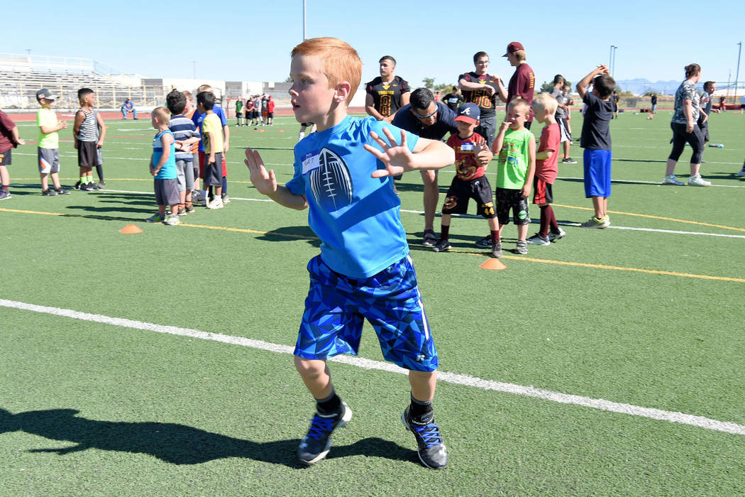 Peter Davis/Special to the Pahrump Valley Times
Young Paul Walker, a youth football player, is showing off his technique.  The youth football camp had nearly 100 participants and was free of charg ...