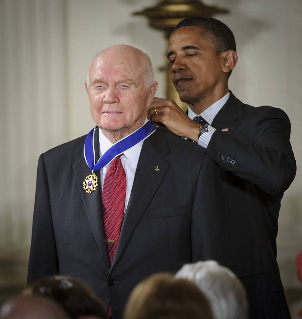 NASA/Bill Ingalls
President Barack Obama presents former Marine Corps pilot, astronaut and retired U.S. Sen. John Glenn of Ohio with a Medal of Freedom on May 29, 2012, during a ceremony at the Wh ...