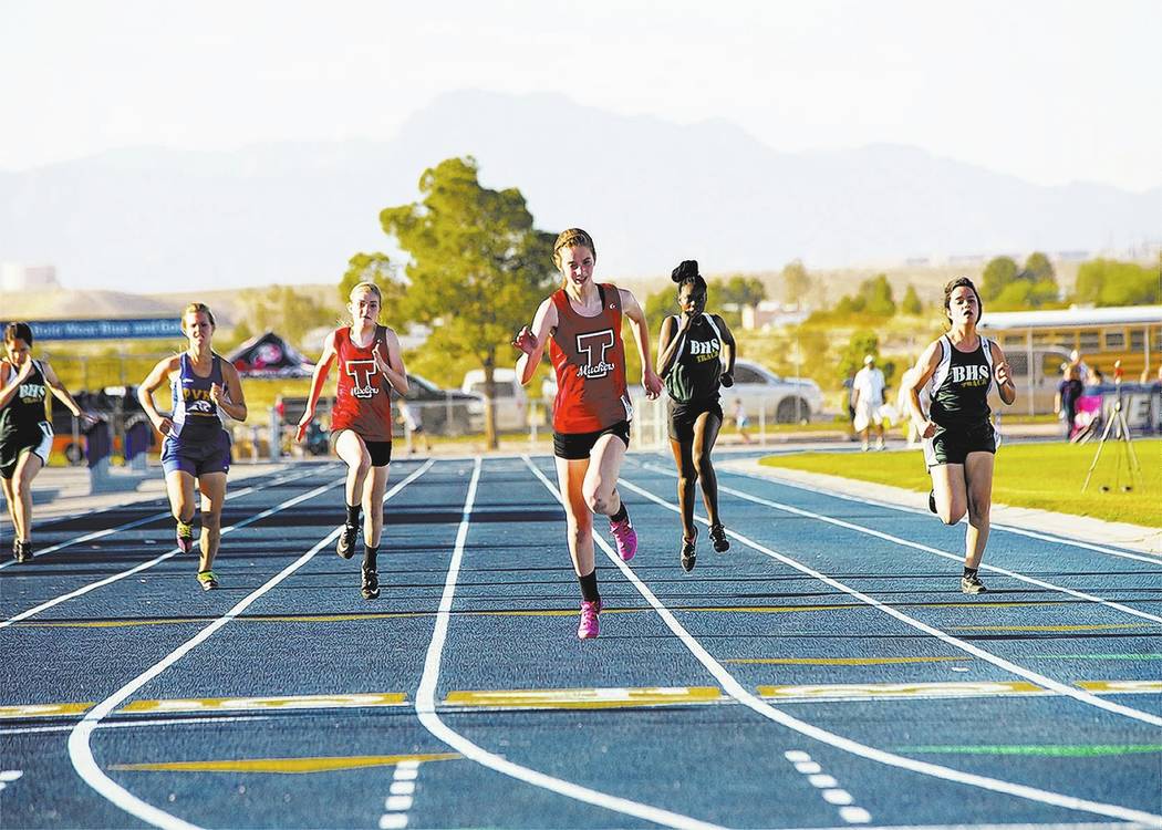 Skylar Stephens/Special to the Times-Bonanza & Goldfield News
Katelyn Maurer (left) taking second and Delaney Friel taking first in the 400-meter run. Friel won two individual championships in ...