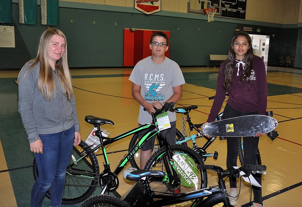 Horace Langford Jr./Pahrump Valley Times  The three students who won a bike at Rosemary Clarke Middle School for perfect attendance, from left to right, seventh grader Alyssa Holmes, sixth grader  ...