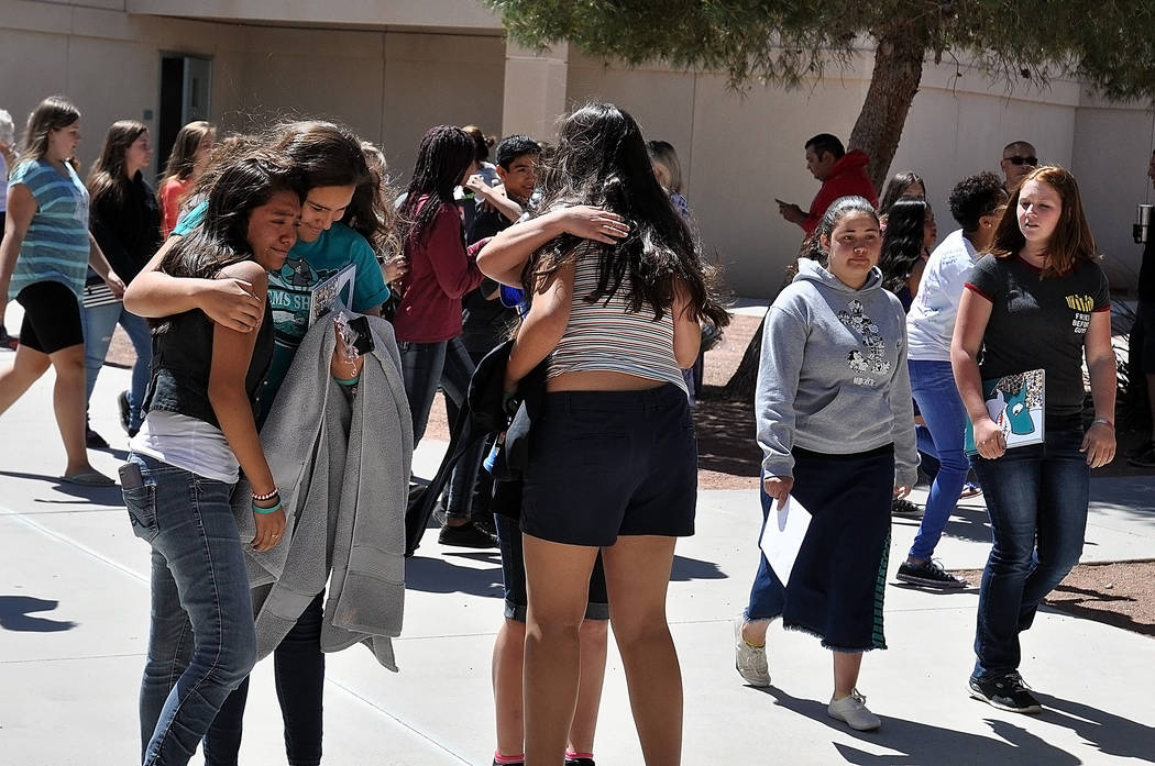 Horace Langford Jr./Pahrump Valley Times  During the "Eighth Grade Walk" emotional eighth graders hug their friends goodbye.