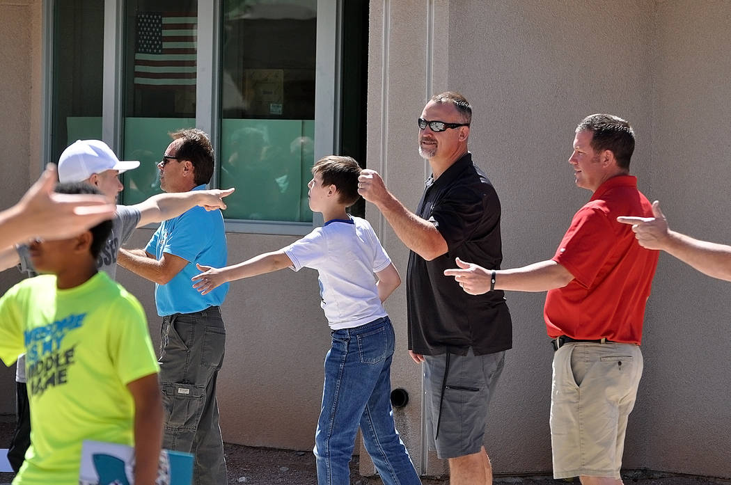 Horace Langford Jr./Pahrump Valley Times 
Eighth graders at Rosemary Clarke Middle School say goodbye to science teacher Joe Clayton as the students walk through the gate to the school for the las ...