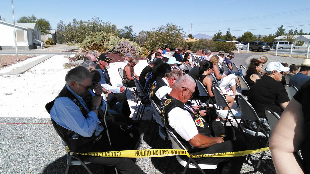 Selwyn Harris/Pahrump Valley Times 
Area veterans bow their heads during a prayer at Monday’s Memorial Day ceremony at G.G. Sweet Memorial Park on Gamebird Road. The observance drew more than 10 ...