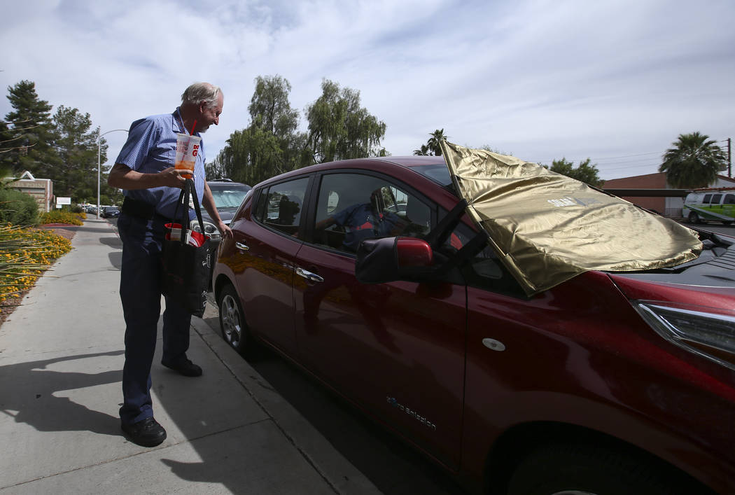 Lloyd Reece, president of the Las Vegas Electric Vehicle Association, next to his 2011 Nissan Leaf in Las Vegas on Wednesday, May 31, 2017. Chase Stevens Las Vegas Review-Journal @csstevensphoto