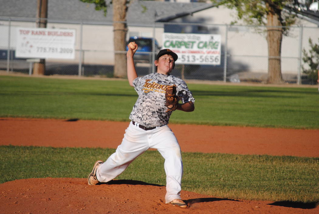 Charlotte Uyeno/
Pahrump Valley Times
Jake Riding pitches the first game at home against the Las Vegas Spartans on May 20. The Trojans have 22 games this summer, 15 of which are at home.