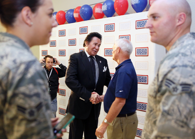 Ronda Churchill/Las Vegas Review-Journal
Entertainer Wayne Newton, center left, shakes hands with Al Kaste, USO area director, during the grand opening of McCarran International Airport's Terminal ...