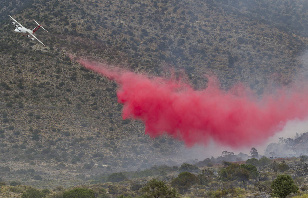 An air tanker drops a load of fire retardant while fighting a wildfire burning on the Pahrump side of Potosi Mountain on Friday, July 7, 2017.  Richard Brian Las Vegas Review-Journal @vegasphotograph