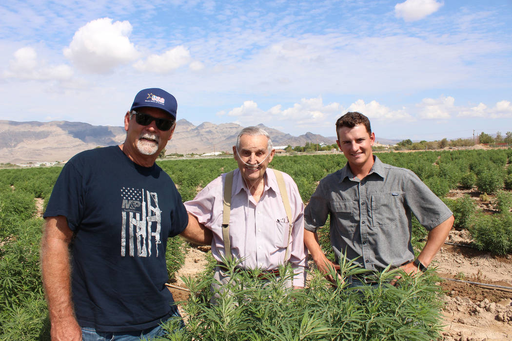 Jeffrey Meehan/Pahrump Valley Times 
Dan Harris (left), Hollis Harris (middle) stand at the family's 10-acre industrial hemp farm at Harris Farm and Blagg roads on July 25, 2017. Warren Jessop (ri ...