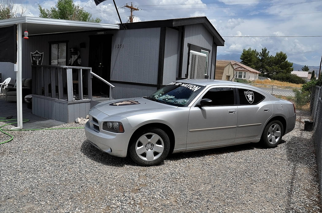 Horace Langford Jr./Pahrump Valley Times -  "Raider Rob's", home and car. One can see the hand painted logo and a good shot of his silver and black Dodge adorned with all the Raider's stickers.