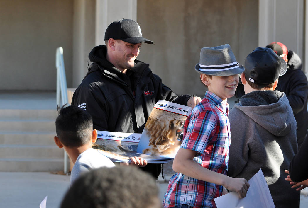 Horace Langford Jr. / Pahrump Valley Times

Jason Coleman hands out posters to the kids at Rosemary Clarke Middle school last year in December just before the Pahrump 250. This year Coleman will m ...