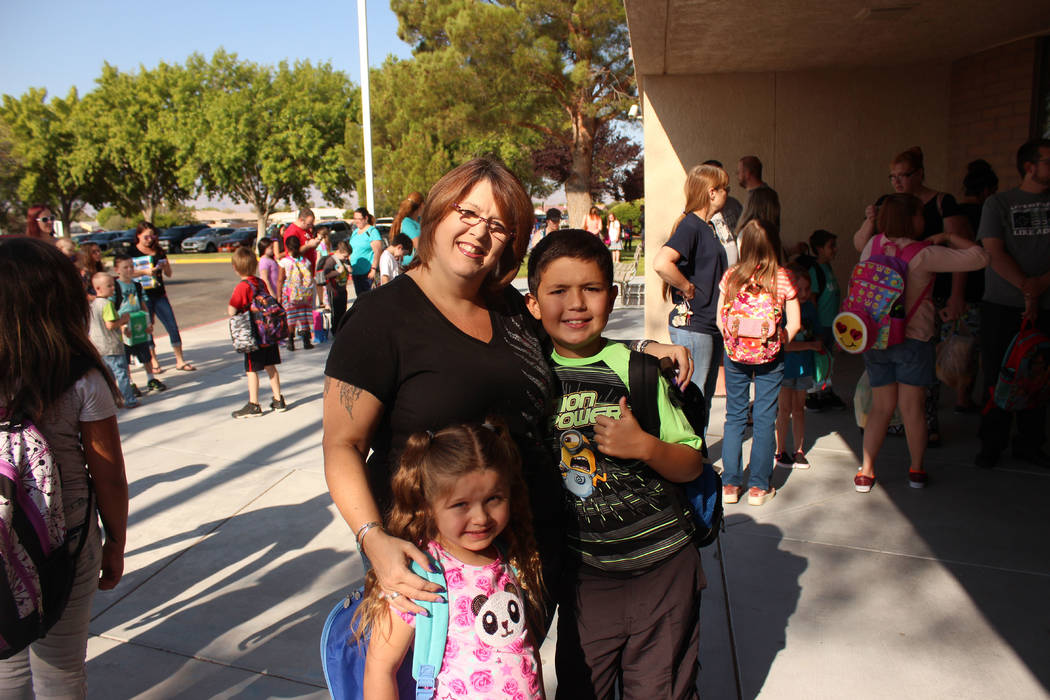 Jeffrey Meehan/Pahrump Valley Times
Charlotte Hernandez, mother of a fourth grader, Roman and first grader, Izza' Bella, wait for the doors to open at J.G. Elementary School on Aug. 7. That was th ...