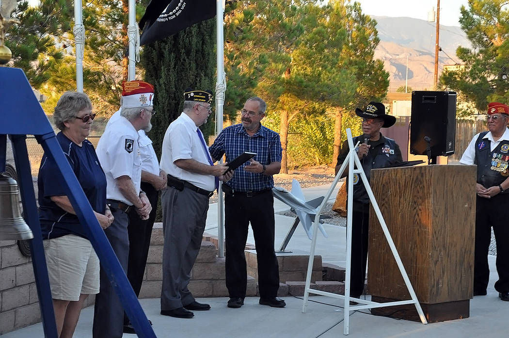 Horace Langford Jr./Pahrump Valley Times 
Nye County Commissioner Dan Schinhofen presents Greg Cardarelli, Commander of Pahrump's DAV Chapter 15, with a Purple Heart Day proclamation from Governor ...