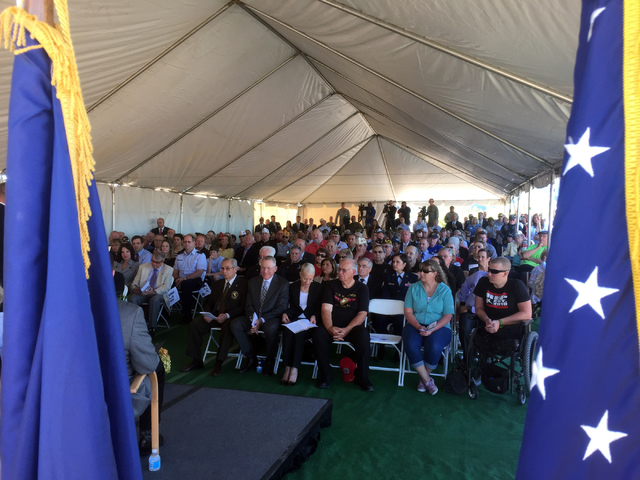 Keith Rogers/Las Vegas Review-Journal
Veterans and VA officials listen to a speaker during a groundbreaking ceremony Friday, March 27, 2015, for Fisher House for wounded warriors near the North La ...