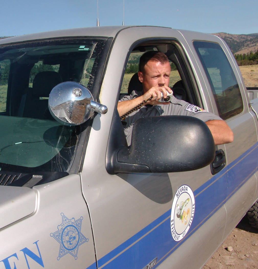 Special to the Pahrump Valley Times 
Game Warden Cameron Waithman checks in on the radio while on wildlife patrol. Officials with the Department of Wildlife said game wardens discovered several ki ...