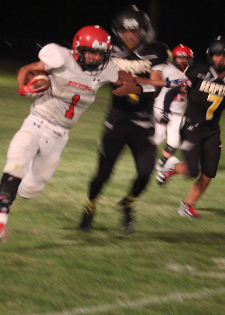 Penny Otteson/Special to the Times-Bonanza & Goldfield News
John Shiflet finds some open ground against Mineral County on Friday. Shiflet had 233 yards, which was nearly half of the total offense.