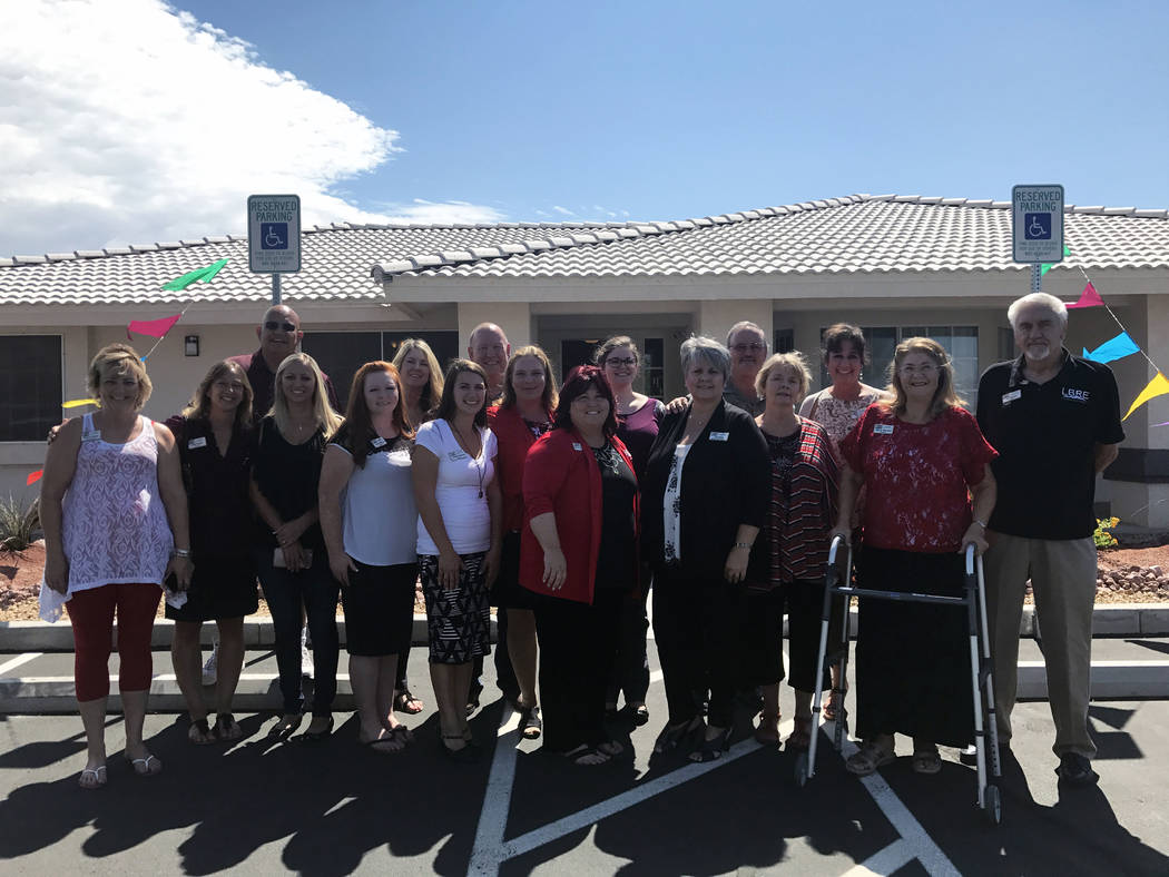 Lisa Bond Real Estate Lisa Bond of Lisa Bond Real Estate stands with