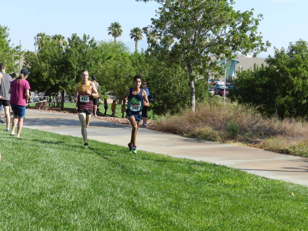 Special to the Pahrump Valley Times

Running neck and neck until the finish, Milton Amezcua for Green Valley and senior Bryce Odegard, left, (16:56) for Pahrump Valley. Amezcua won in the final se ...