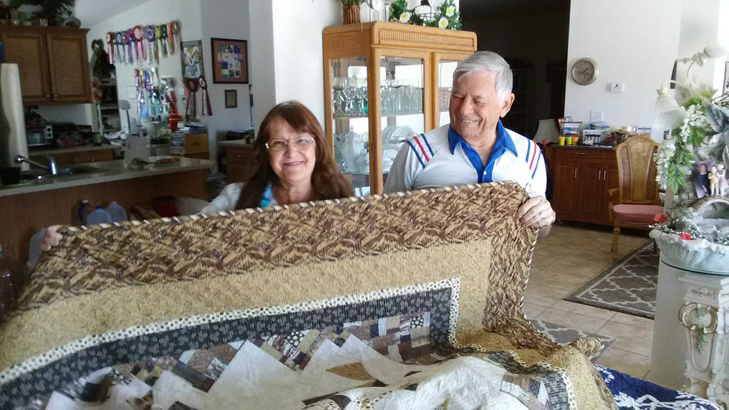 Selwyn Harris/Pahrump Valley Times 
Pahrump quilter Barbara Shear and husband Burt display one of her many handmade quilts in her home. Shear was one of 396 quilters whose work will be judged duri ...