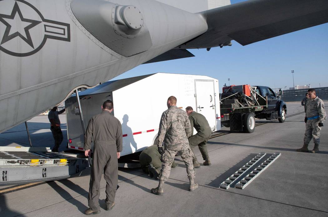 Nevada Air National Guard airmen load the 152nd Airlift Wing's Joint Incident Site Communications Capability system into a C-130 on Sunday. The Air Guard left Monday to assist with Hurricane Irma  ...
