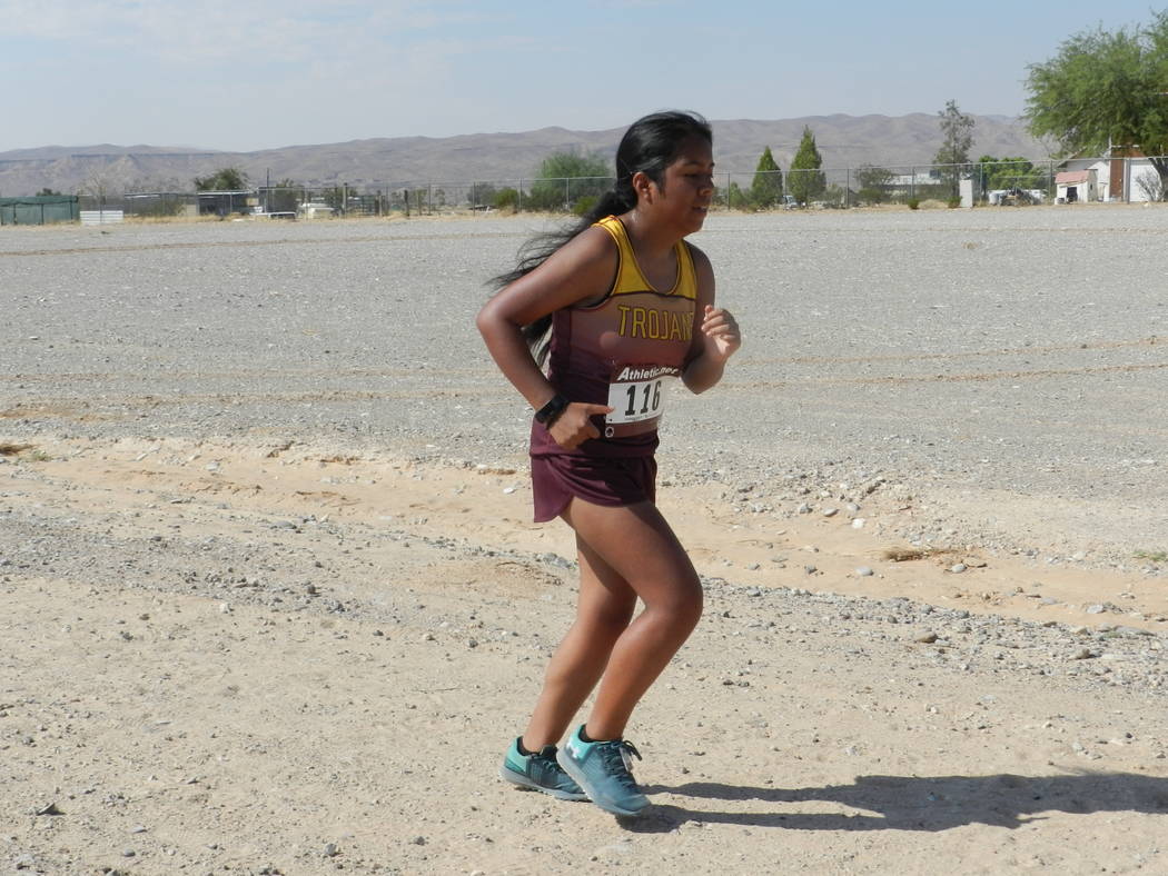Special to the Pahrump Valley Times

Senior Carmen Changano runs her heart out at the Moapa Valley Invitational last week. The Trojans girls team came in second place.