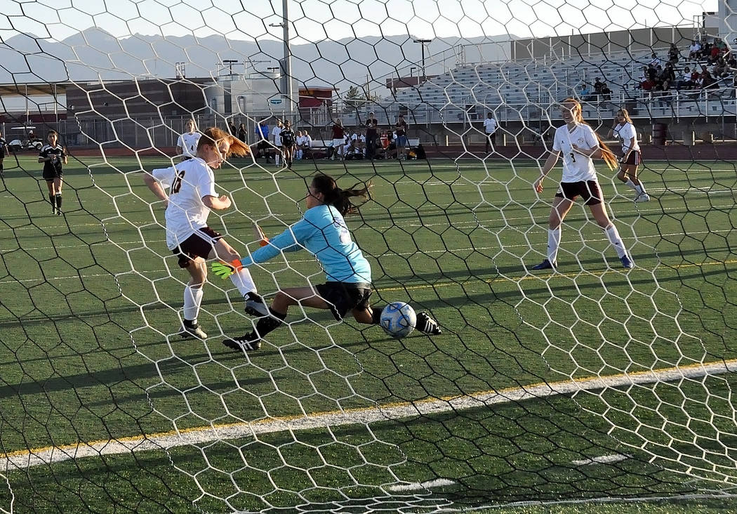 Horace Langford Jr./Pahrump Valley Times

Freshman Makayla Gent of the Trojans puts one past the goalie against Desert Pines in league action on Tuesday night. Gent scored three goals that game.