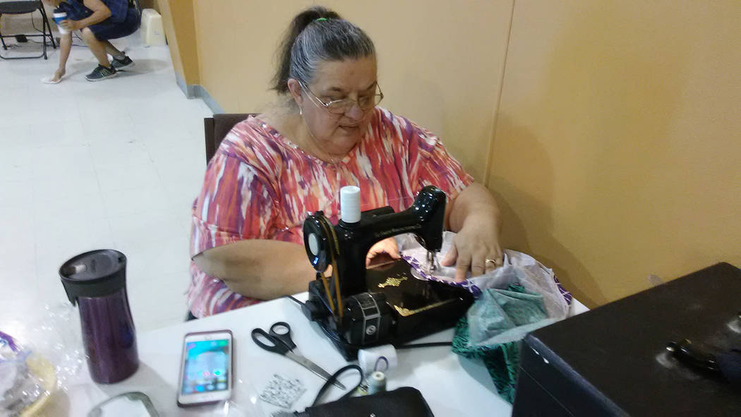 Selwyn Harris/Pahrump Valley Times 
Pahrump resident Barb Johnston works to creat e much-needed items for students within the Nye County School District. Johnston and upwards of a dozen volunteers ...