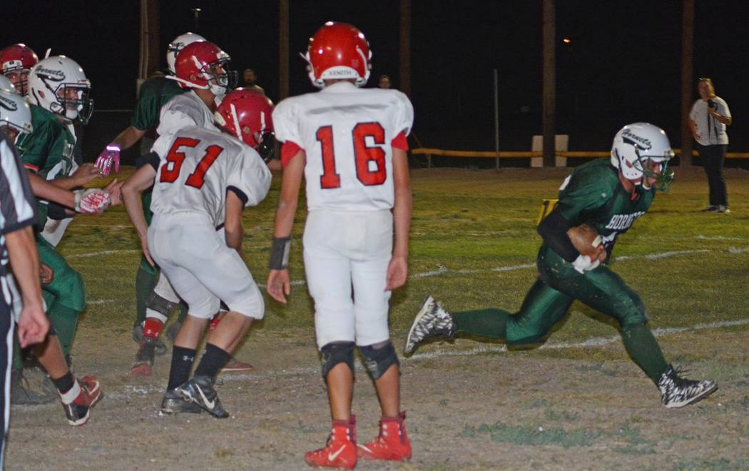 Richard Stephens/Pahrump Valley Times

Jose Moreno scores a TD against Tonopah on Friday night. Beatty beat the Muckers 66-18.
