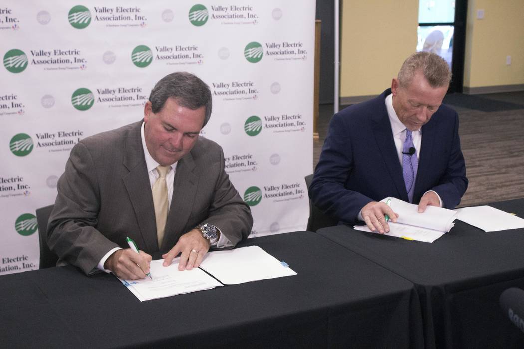 Jeffrey Meehan/Pahrump Valley Times
Calvin Crowder, Gridliance president and CEO (left) and Thomas Husted, CEO of Valley Electric Association, sign the final documents for the completion of the sa ...