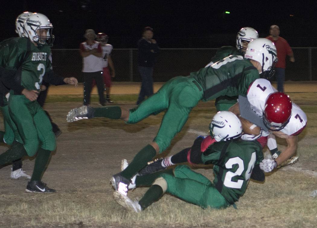Richard Stephens/Pahrump Valley Times
Jacob Henry and Yadir Rodriguez make a tackle in the Beaver Dam game last Friday night.