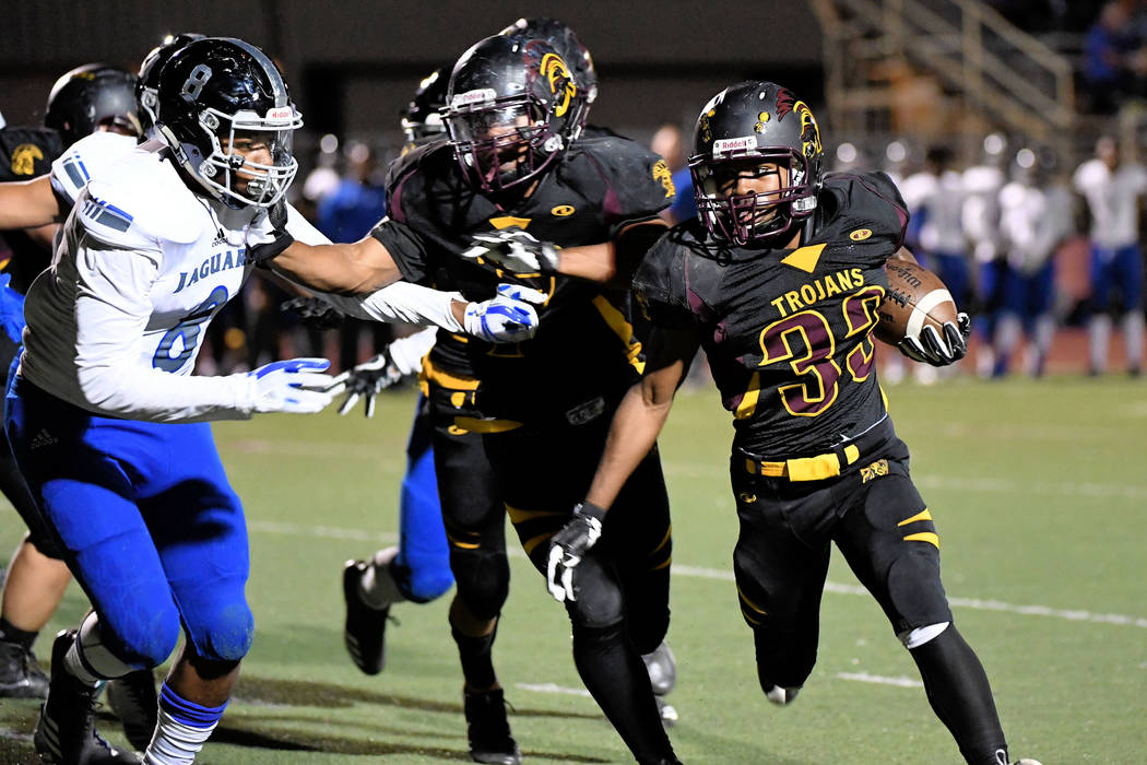 Peter Davis/Special to the Pahrump Valley Times

Junior running back Casey Flennory runs the ball against the Jaguars. Last week the Trojans were able to run the ball against Desert Pines, the def ...