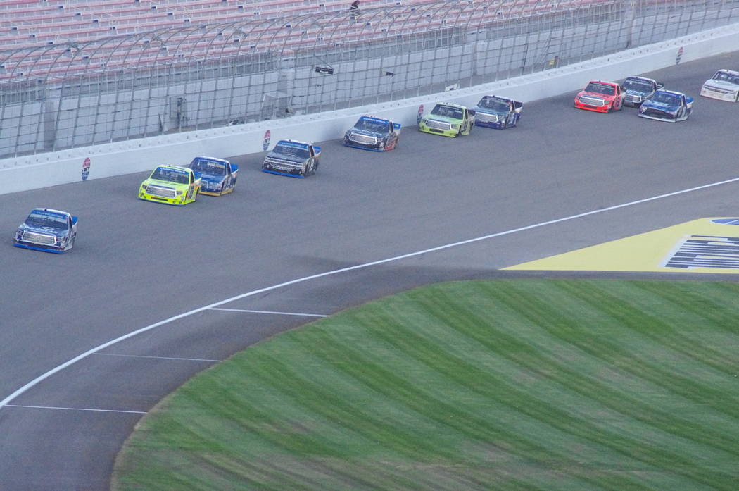 Vern Hee/Pahrump Valley Times

Trucks during the Camping World NASCAR Truck series come within inches of the wall on the fourth turn at the Las Vegas Motor Speedway.