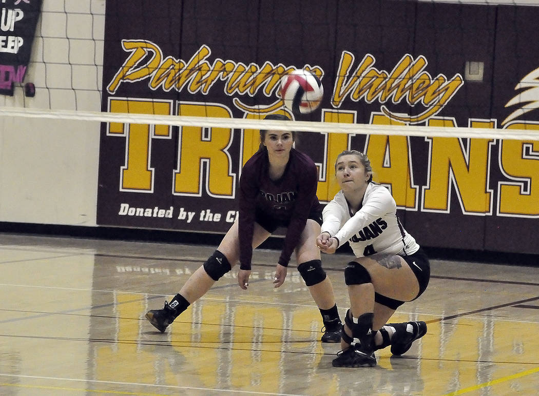 Horace Langford Jr./Pahrump Valley Times

Junior Sabin Chaidze digs one out as Trojans libero, sophomore Madison Hansen, looks on.