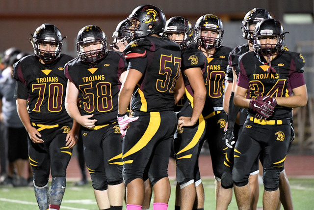 Peter Davis / Special to the Pahrump Valley Times
The Trojans line wait for a play to be brought in. Behind their blocking, the Trojans running backs scored three touchdowns in the come-from-behin ...