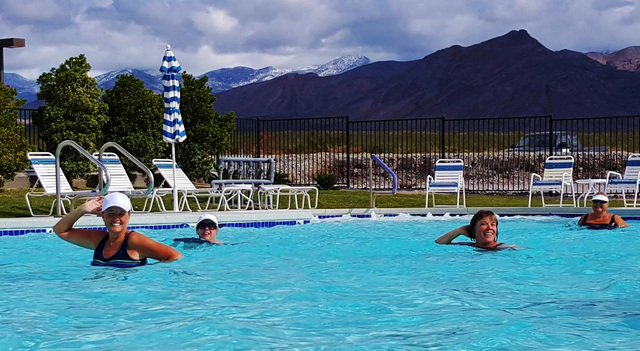 Bathers brave cold temperatures while enjoying the pool at Wine Ridge RV Resort & Cottages with snow-clad mountains in the backdrop. The resort is hosting its inaugural Polar Bear Plunge on Fr ...