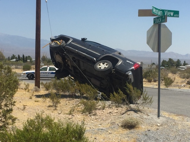 Special to Pahrump Valley Times 
No injuries were reported after the driver of a pickup truck lost control and ended up suspended on a ‘guy wire’ at the intersection of Mountain View Avenue an ...