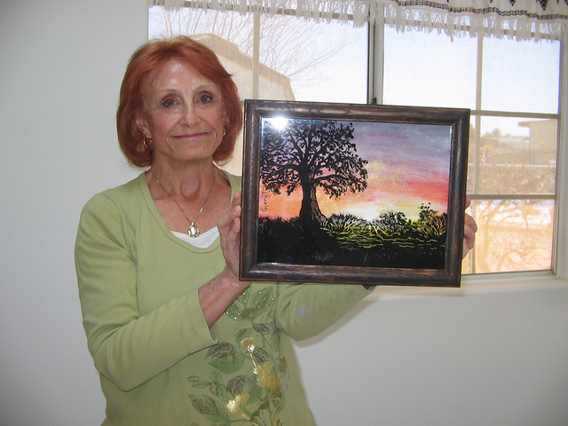 Pahrump artist Cheryl Tocco displays one of her reverse glass paintings. She teaches the ancient art form as part of the Art 4 Seniors program sponsored by RSVP (Retired and Senior Volunteer Progr ...