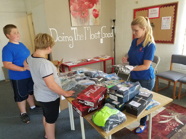Shambra Jones, coordinator for the Salvation Army in Tonopah, on Aug. 1 helps prepare school backpacks for students in need. The effort also includes new back-to-school clothing for 20 students.   ...