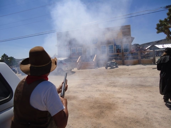 A man shoots off a gun as part of the Civil War reenactment at a past Goldfield Days event. This yearâs event takes place Friday, Aug. 5-7.  Special to the Pahrump Valley Times