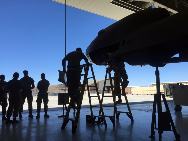 Airmen assemble the airframe for an MQ-9 Reaper remotely piloted aircraft in June 2015 inside a hangar at Creech Air Force Base, 55 driving miles northeast of Pahrump. 
Keith Rogers/Special to the ...