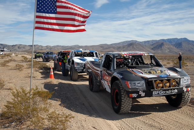 Trick trucks line up at the time trials on Thursday for the Pahrump Nugget 250. There will be nearly 150 racers for Saturday’s race, which starts in Johnnie at 8 a.m. There will be a 16-mile par ...